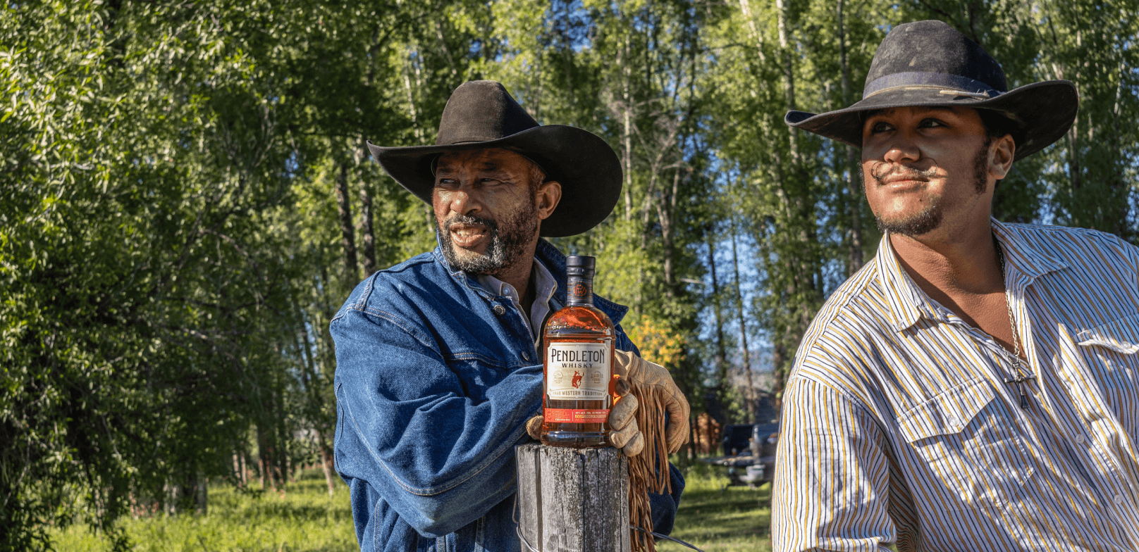 Cowboys with a bottle of Pendleton Whisky on a ranch