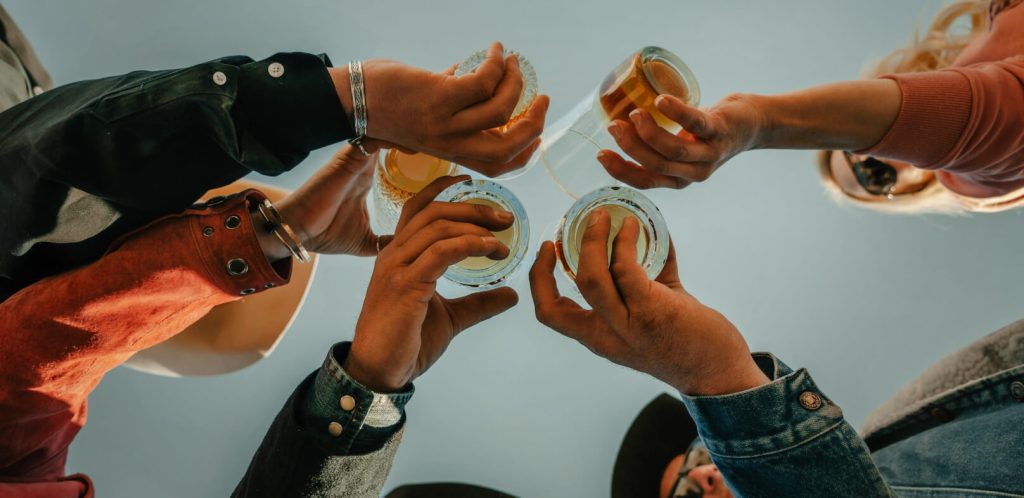 Cowboys and cowgirl drinking whisky